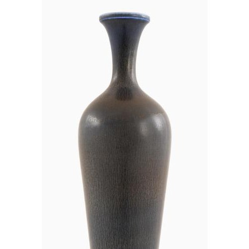 This rare large ceramic vase, designed by Berndt Friberg and produced by Gustavsberg in Sweden in 1963, is a refined...