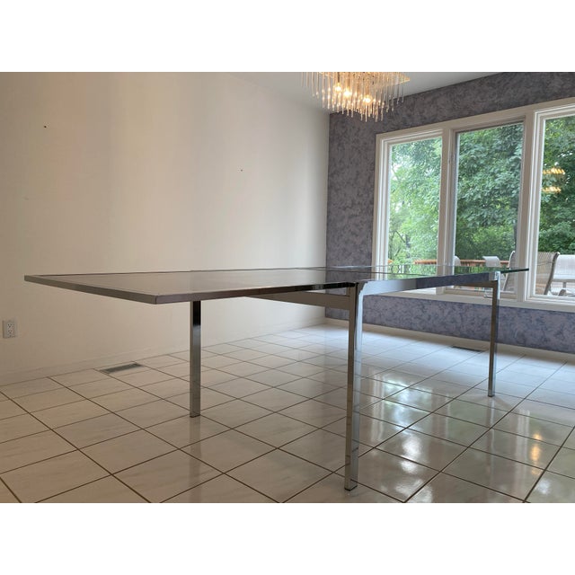 Vintage Design Institute of America (D.I.A.) Expandable Chrome Glass Dining Table, 1994 This exceptional dining table from...