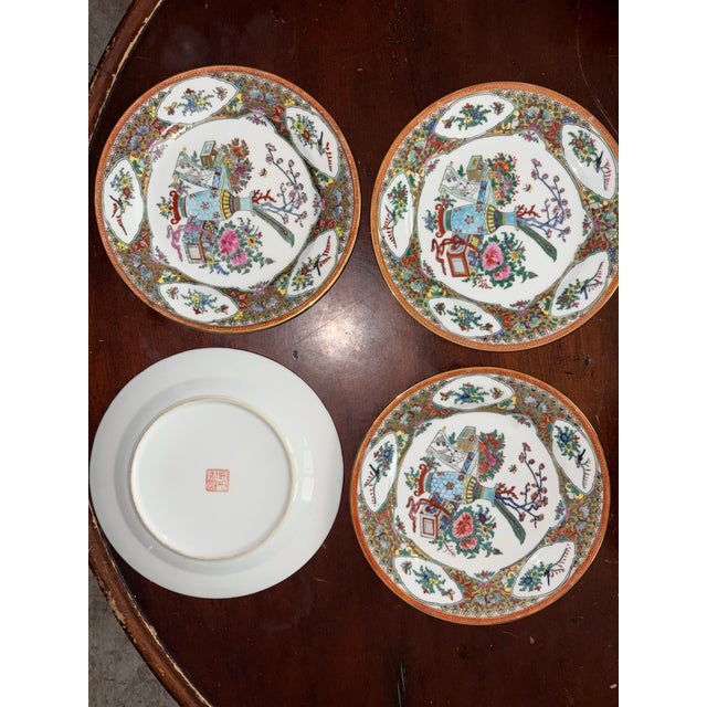 Beautiful set of 4 vintage Chinese porcelain decorative plates. These feature a high-detail Millefleur (thousand flowers)...