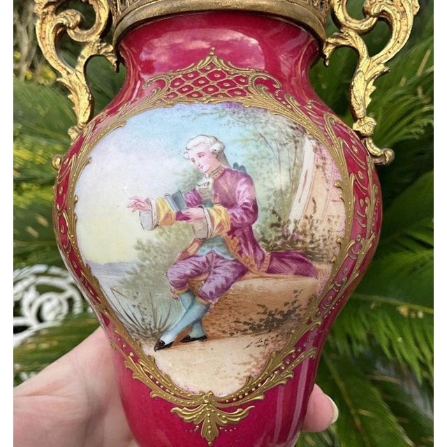 A highly decorative pair of late 19th-century french sèvres-style porcelain and gilt-bronze vases, circa 1880,...