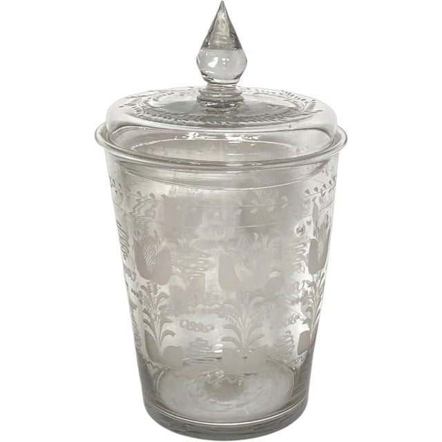 DETAILS An antique, hand blown flip drinking glass tumbler with round tapering sides, engraved with Stiegel-type tulips....