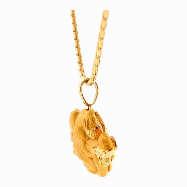 Vintage Carrera y Carrera pendant with chain, crafted in 18k yellow gold. Features an intricate design depicting two...