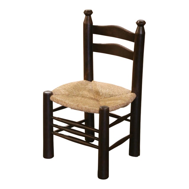 Early 20th Century French Carved Walnut Child Chair With Rush Seat For Sale