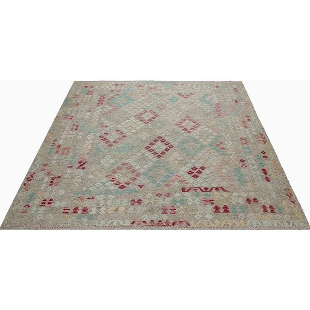 This fun rug is a beautiful Geometric Swedish Style Flatweave area rug featuring a tile and geometric shape motif in a...