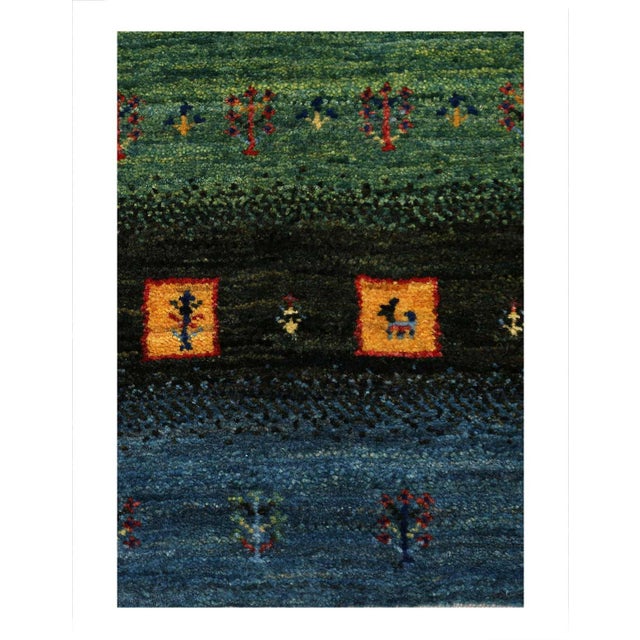 The word “Gabbeh” literally translates to “in the rough,” and it is an accurate description of this style of Persian rug....