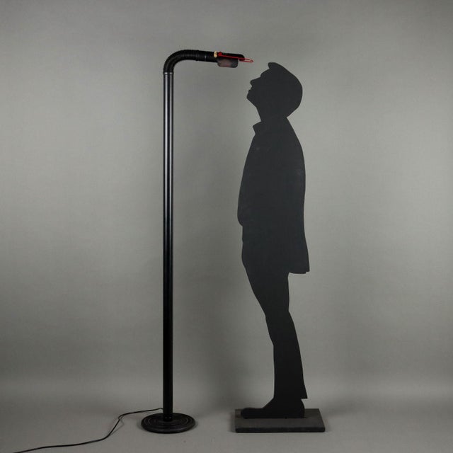 Floor lamp in enamelled metal, adjustable via the flexible part. This piece is attributed to the mentioned designer/maker....