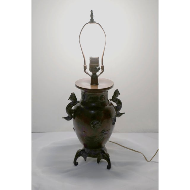 I love, love, love this lamp with its serious silhouette that includes dragon/dogs and pachyderms. It is made in the style...