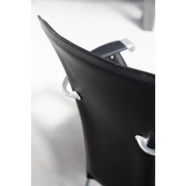 Stine Line 1990s Leather Armchair – Sleek Black Italian Design with Modern Flair : Experience the perfect blend of...