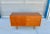 Danish modern teak credenza designed by Carol Jensen and manufactured by Hundevad & Co. in Denmark circa 1960s. This...