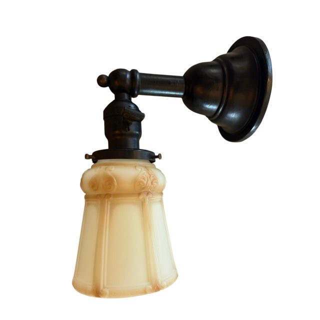 This great cased glass wall sconce will add elegance and charm to any bathroom, entryway, or special room of the house....