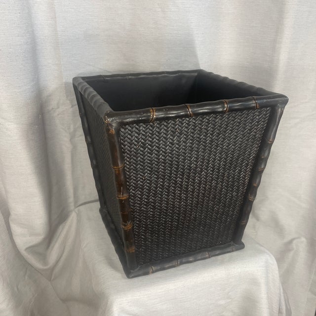 Add a touch of elegance with this Faux Bamboo and Wicker Waste Basket.