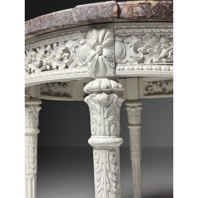Gueridon / Coffee table / Side table. Originating from France, 19th century. All surrounding leaves are hand-carved. White...