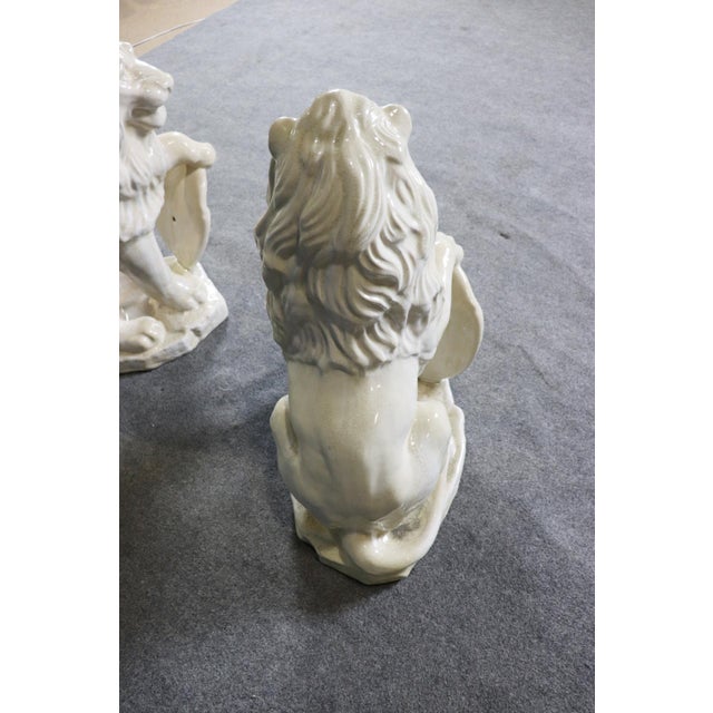 Pair Large White Glazed Ceramic Figures of Entryway Lions Paws Raised on Shield For Sale - Image 12 of 12