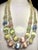 This double-strand necklace by Louis Rousselet features signature mid-century French mold-pressed pastel satin glass...