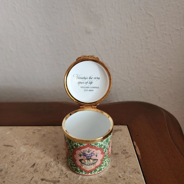 Mini enamel box is made by Halcyon Days of England. It features a various spices on the lid and around the sides and the...