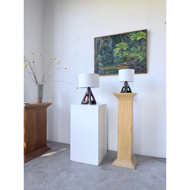 Set of two vintage ceramic table lamps with a free-form, triangular shape and central perforations, dating from the 1950s....