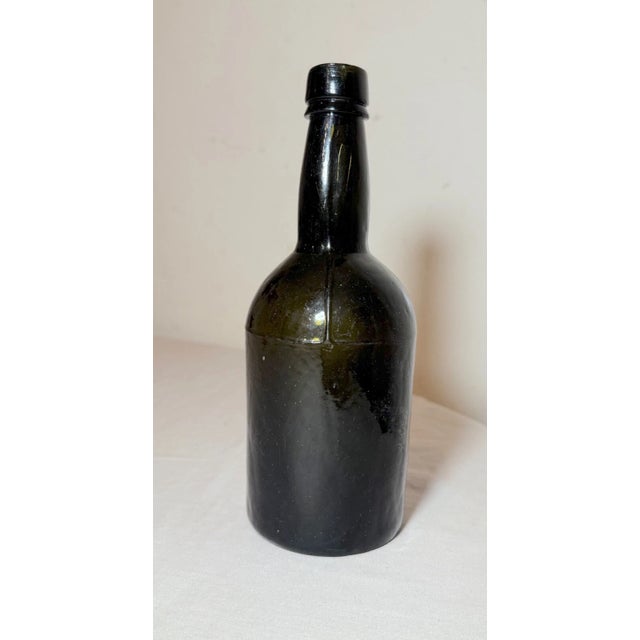 Up for sale is a rare antique 18th century handmade whiskey glass bottle. It has lovely imperfections and is mold blown...