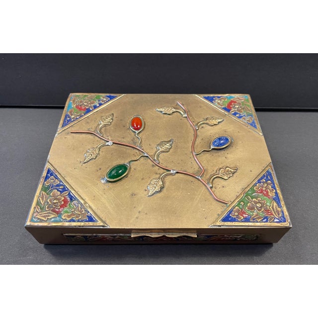 Antique Chinese brass box with orange, blue and green stones; and enameling five sides. Wood lined and dived in two...