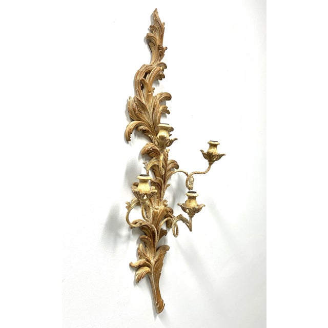 A Rococo style candle wall sconce by Marbro Lamp Company, of Los Angeles, California, USA. Solid wood with a whitewashed...