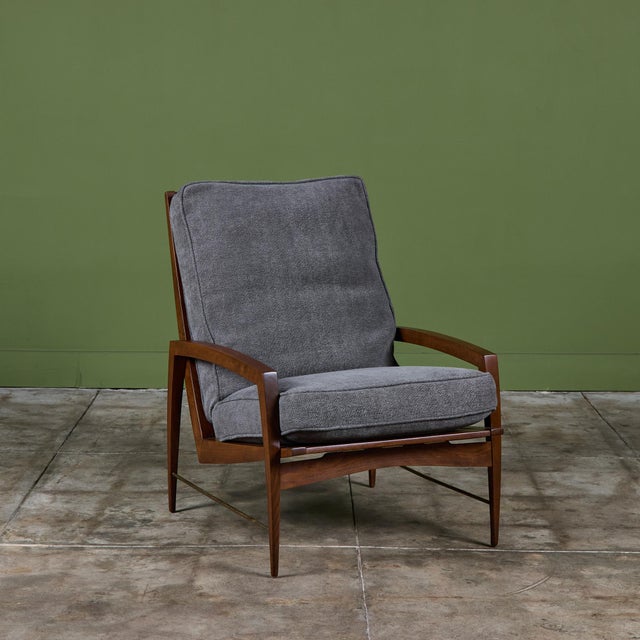 Lounge chair by Dan Johnson for Selig c.1960s, Denmark. The lounge chair features a sculpted wood frame with curved...