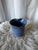 This vintage studio pottery vase features a deep blue, speckled glaze and a unique, hand-shaped heart form. Signed by the...