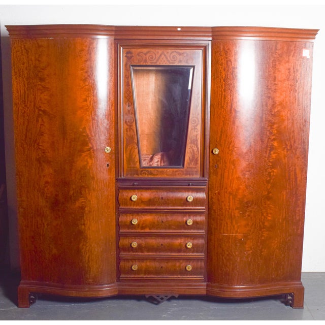 This large and robust wardrobe is a distinctive piece of sacristy furniture, crafted in solid wood in the Art Nouveau...