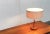 Mid-Century teak table lamp from the Swiss manufacturer Temde. Simple design language in high quality materiality. The...
