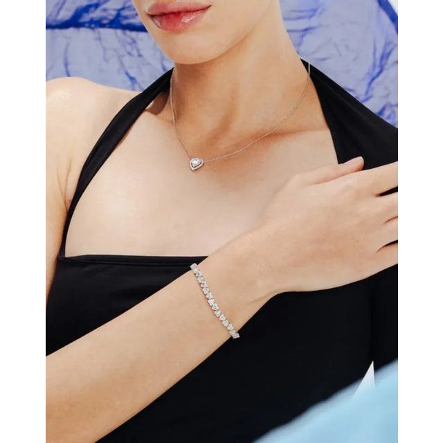 This is part of Chairish’s Fine Jewelry assortment. This Timeless Natural 2.11ct Diamond Heart Tennis Bracelet in 18K gold...