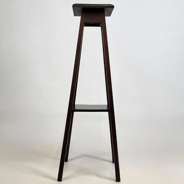 A charming and beautifully proportioned early 20th-century English Edwardian plant stand, finely constructed in oak and...