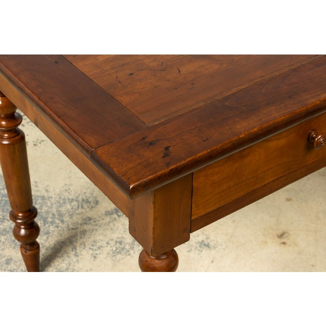 A French Louis Philippe period walnut writing table dating to the mid-19th century, sourced in Provence, France. The table...