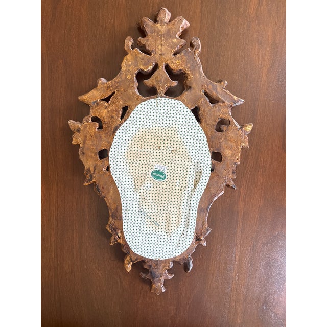In a world of mass made mirrors; this vintage hand crafted piece is one of a kind. This hand crafted Italian giltwood...