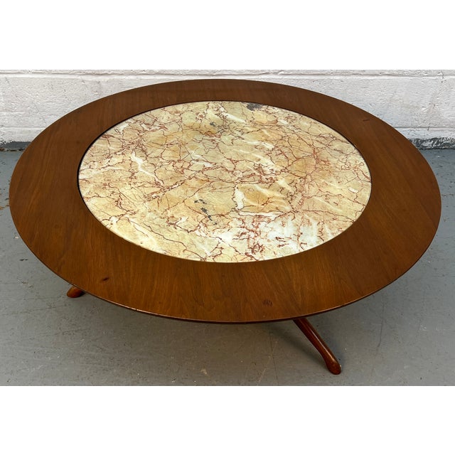 Add a touch of sophistication to your living space with this mid-century modern wood coffee table featuring a faux marble...
