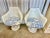 Pair of vintage white fiberglass Saarinen style tulip arm chair with blue and white cotton Toile pattern cushions. No...