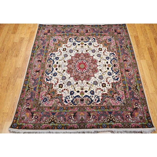 "A magnificent Persian Tabriz square rug hand-woven in one of the most esteemed workshops in the historic city of Tabriz....