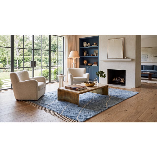 Elevate your space with this luxurious modern Moroccan-style wool area rug, hand-crafted to capture a effortless blend of...