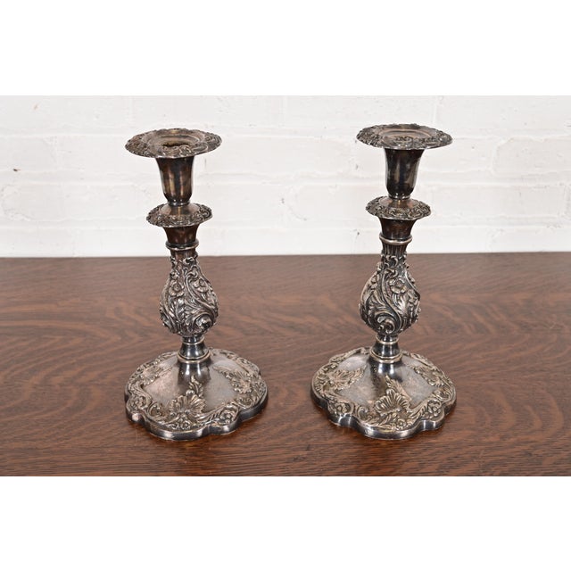 A gorgeous pair of Victorian or Rococo ornate silver plate candlesticks By Sheffield England, Circa Early 20th Century...