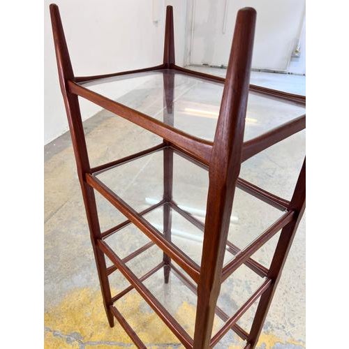 This teak shelf is an exceptional example of Danish furniture design, captivating with its combination of materials and...