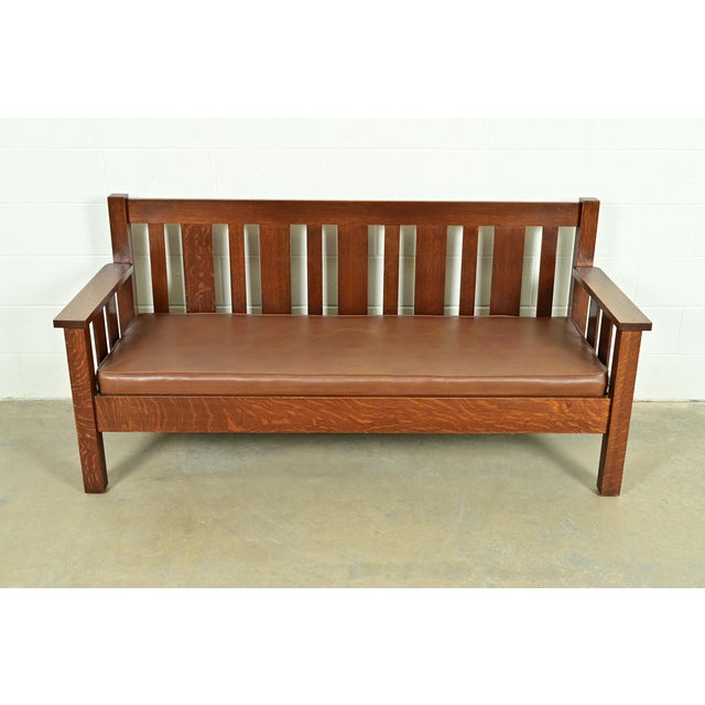A gorgeous antique Mission or Arts & Crafts period settle sofa, bench, settee, or love seat In the manner of Charles P....