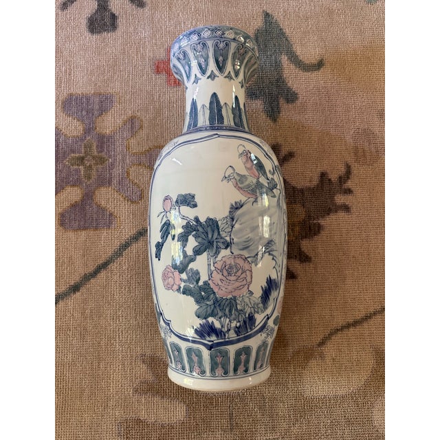 Elevate your home decor with the timeless elegance of this vintage Chinoiserie porcelain vase. Featuring a beautiful...