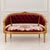 Make a sophisticated statement with this French-inspired sofa, featuring rich burgundy velvet upholstery, a deeply tufted...