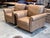A handsome pair of Bassett Jackson leather chairs with a substantial, traditionally tailored presence. Upholstered in warm...