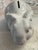 A charming Tiffany & Co. Austria ceramic bunny bank, circa mid-20th century. Finished in glossy white with pink polka...
