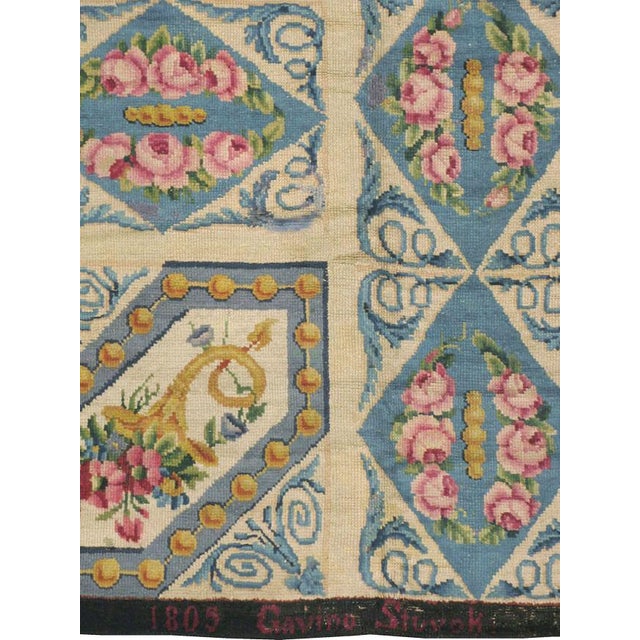 An antique European Savonnerie carpet from the turn of the 19th century; signed "Gavino Stuvok" and dated "1805."...