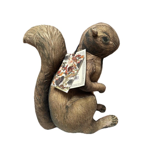 The John Derian Target Squirrel Pillow is a charming addition to any woodland-themed home decor. Made with beaded accents...