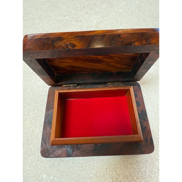 Handsome Italian burlwood box from the 1970s, featuring beautifully figured wood grain with rich, swirling patterns and a...