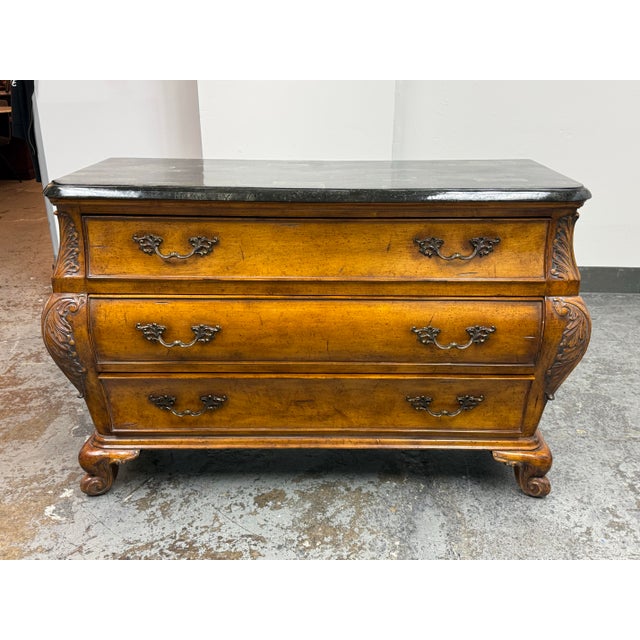 Design Plus Gallery presents a Faux Stone Top Bombe Chest of Drawers of the French Provincial Style. This chest showcases...
