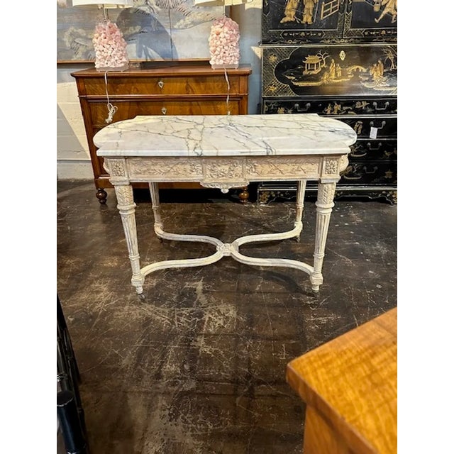 Fabulous 19th century French Louis XVI carved and painted center table with original marble top. An exquisite piece and...
