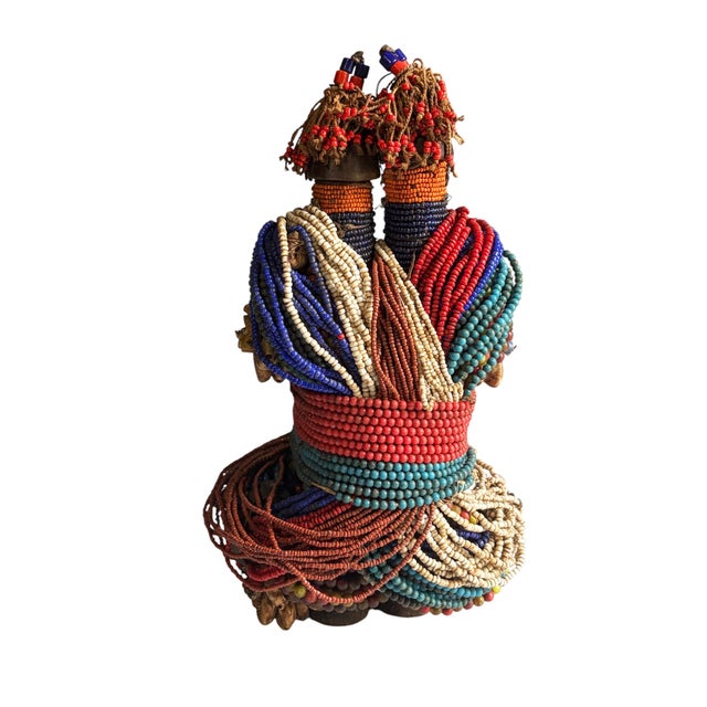 Superb vintage African Fali Namji twin fertility dolls adorned with multiple layers of trade glass beads leather strips...
