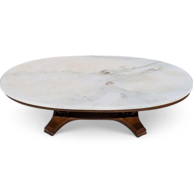Mid-Century Italian Coffee Table with Oval Marble Top A refined Mid-Century Italian coffee table featuring an oval white...