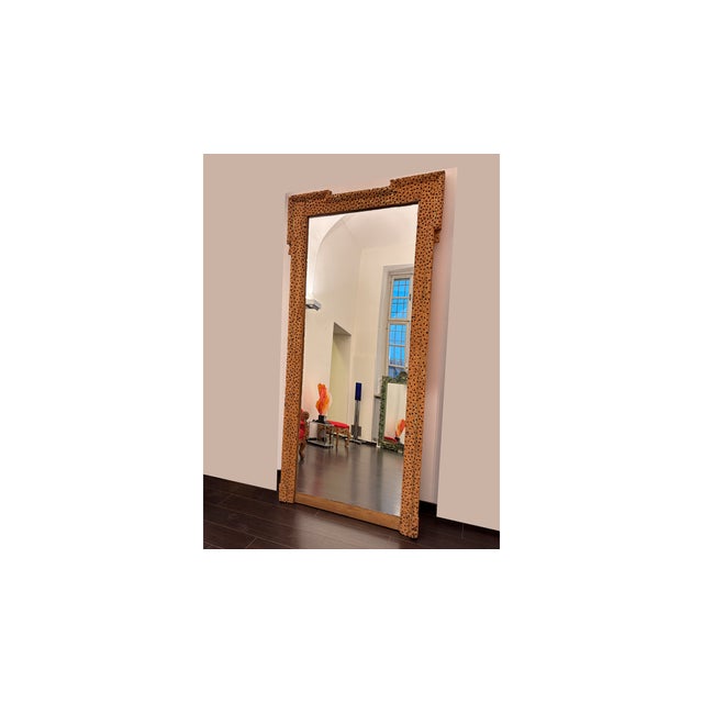 This impressive mirror, created by artist and sculptor Urano Palma, features a hand-carved and engraved wooden frame. The...